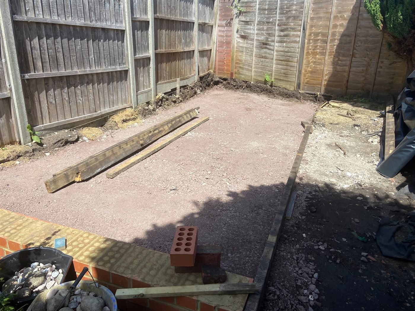 The prepared sub-base and brick retaining edge, before the membrane, reinforcement and concrete.